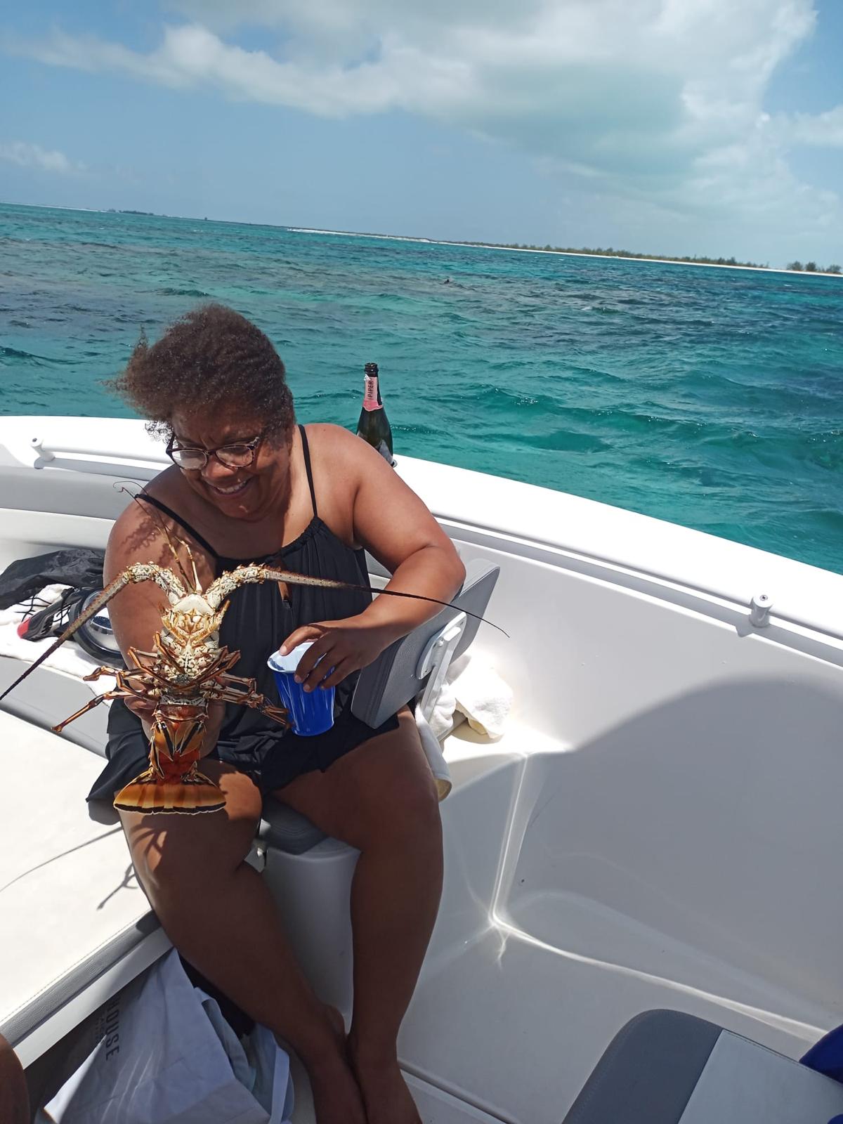 Guest with fresh lobster and champagne