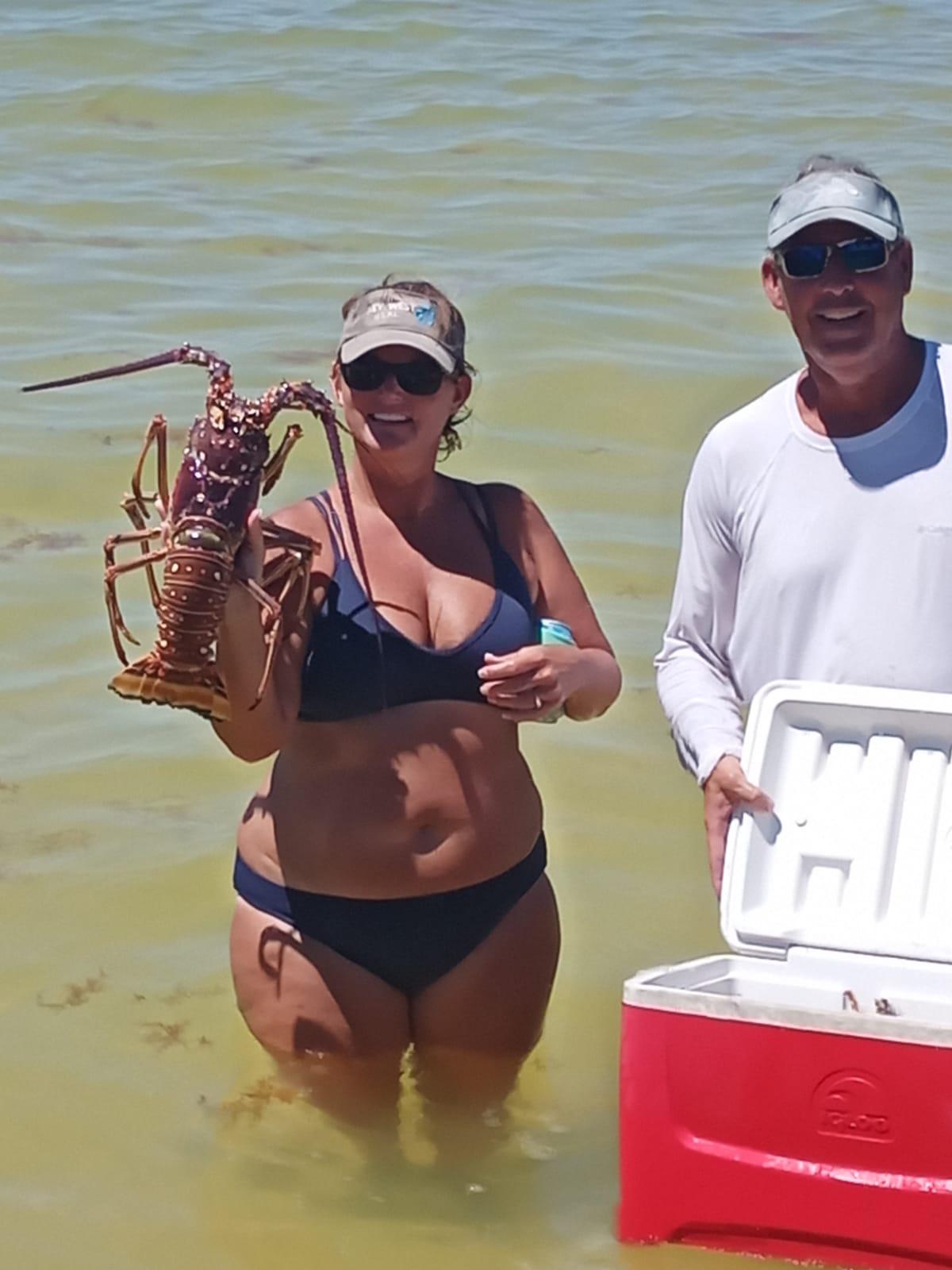 Wading back to shore with a fresh lobster